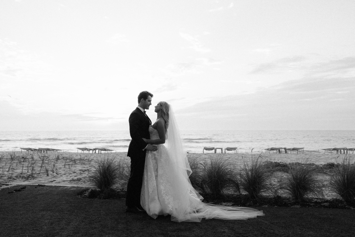 couple looking at each other by naples florida wedding photographer
