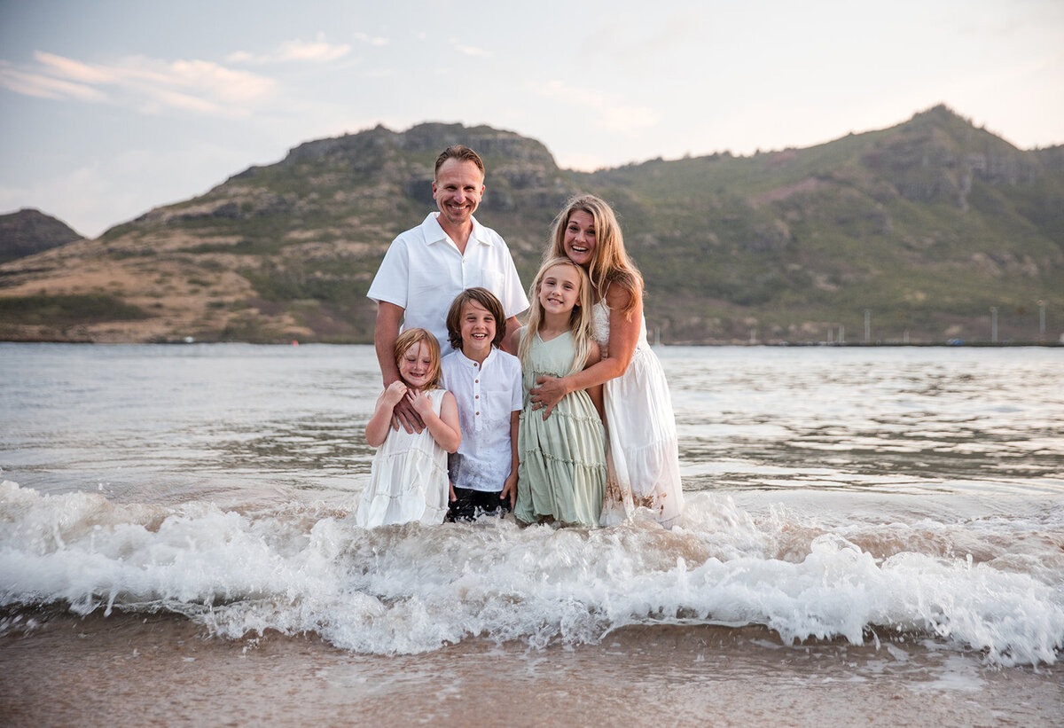 family smiling on Kalapaki beach