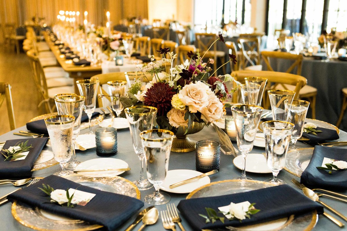 Wedding reception at Roche Harbor resort with navy napkins, French blue linens, and fall flower centerpieces