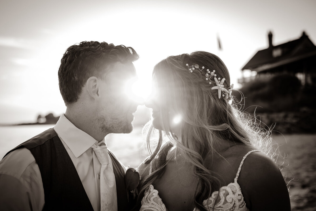 A black and white photo of a bride and groom on their wedding day.