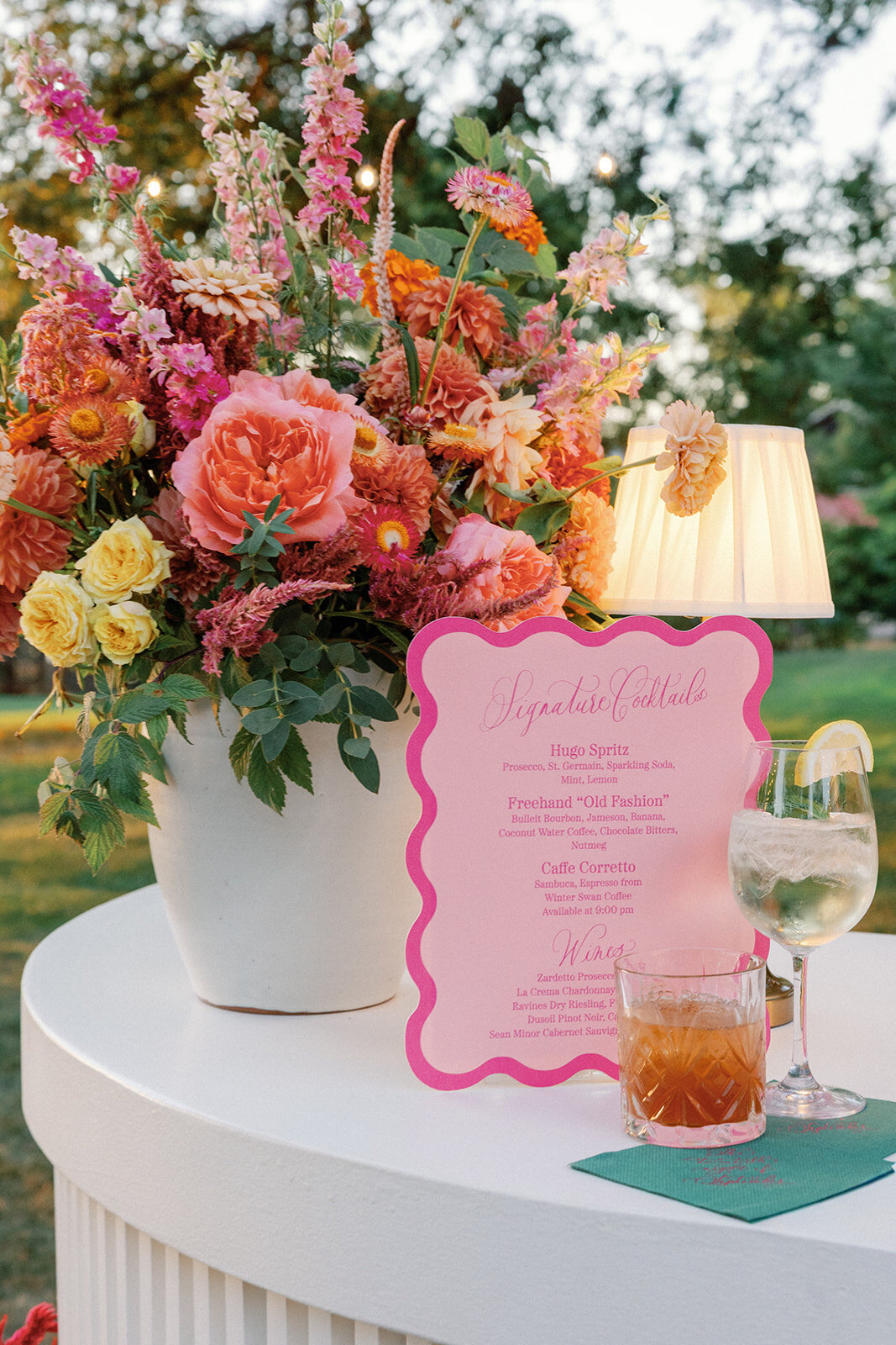 Scalloped Wedding Bar Sign with Colorful Flowers and Lamp at New York Wedding - Verve Event Co. - Laura Rose Photo (1)