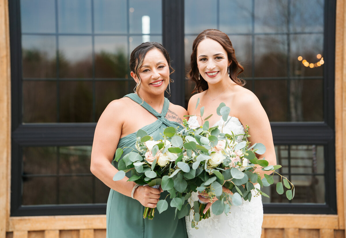 Bride and groom laughing together during wedding day portraits