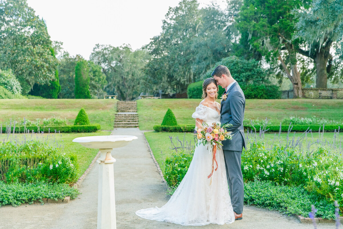 couple posing at middleton place wedding