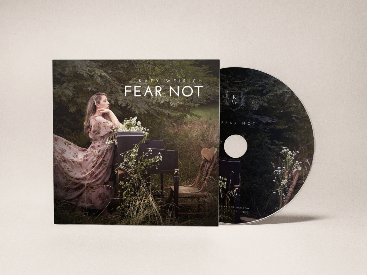 cd-mockup-coming-out-of-a-cardboard-sleeve-a15212 (1)