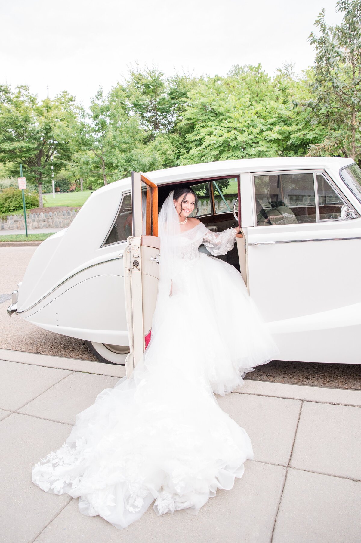 bride exiting rolls royce