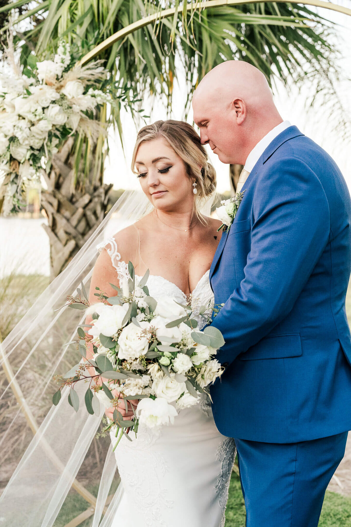 The-Gulf-Florida-Wedding-Photos-Video-Film-Megan-Chase-Sweet-Embrace-Bride-Groom-Looking-Down