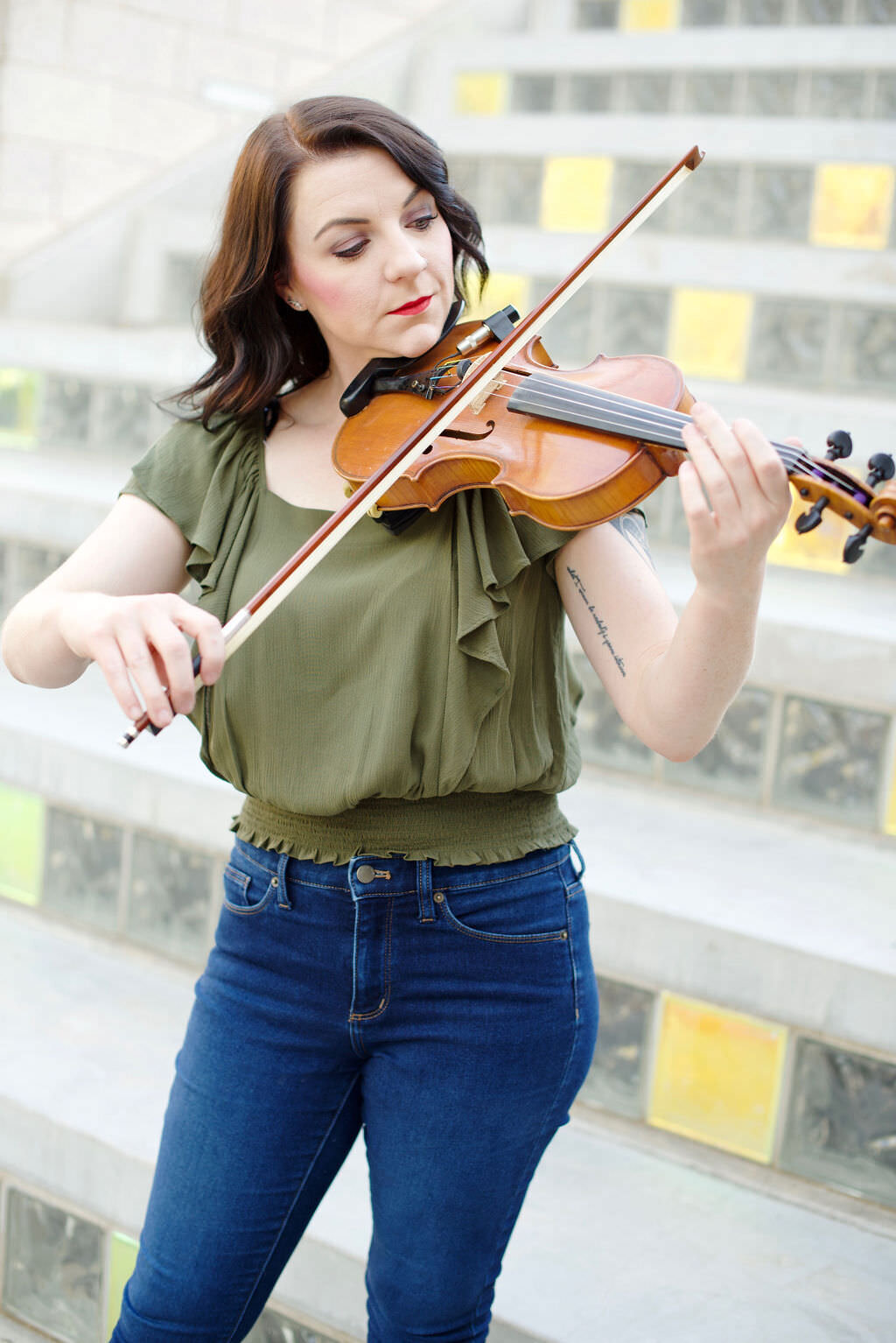 A woman playing a violin.