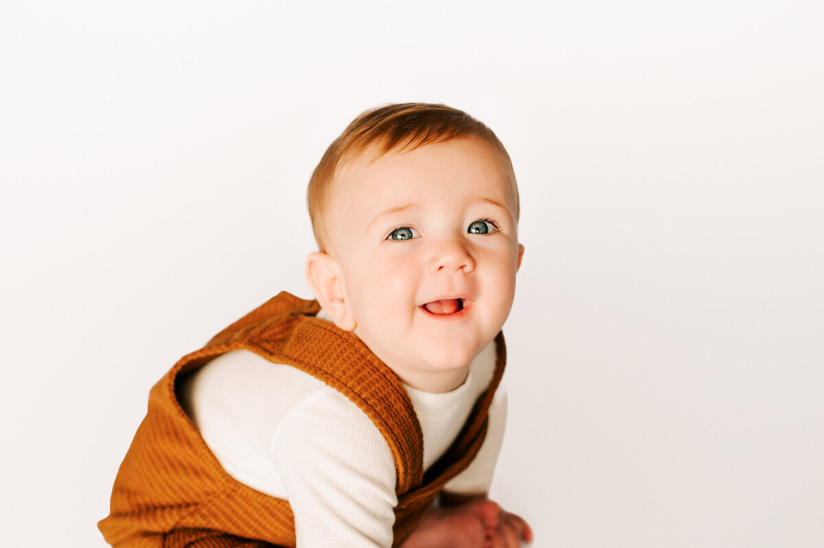 baby boy smiling in Springfield Mo milestone and kids photography studio