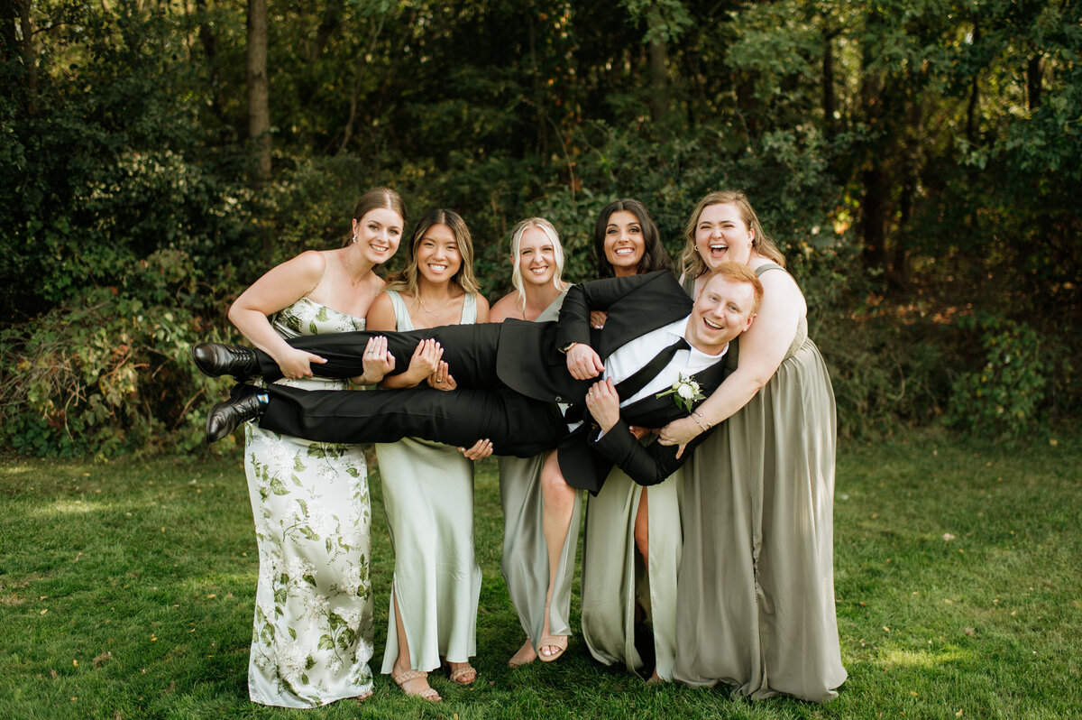 Bridesmaids smiling in outdoor with Groom in South Bend wedding