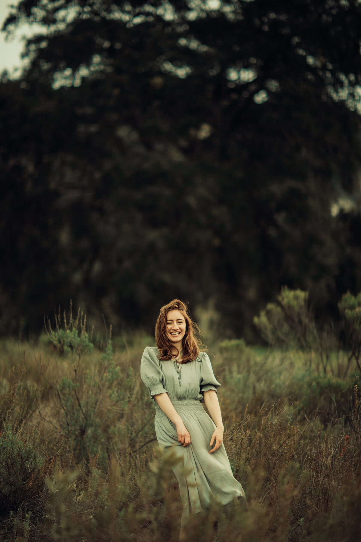 Portrait Photo Of Young Woman In Green Dress Smiling Los Angeles