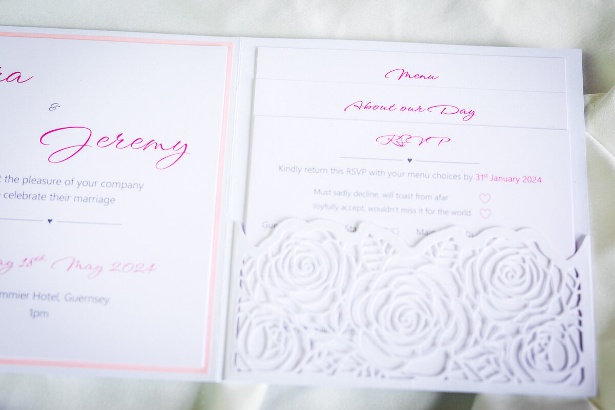Handcrafted lacy wedding invitation with rose pattern