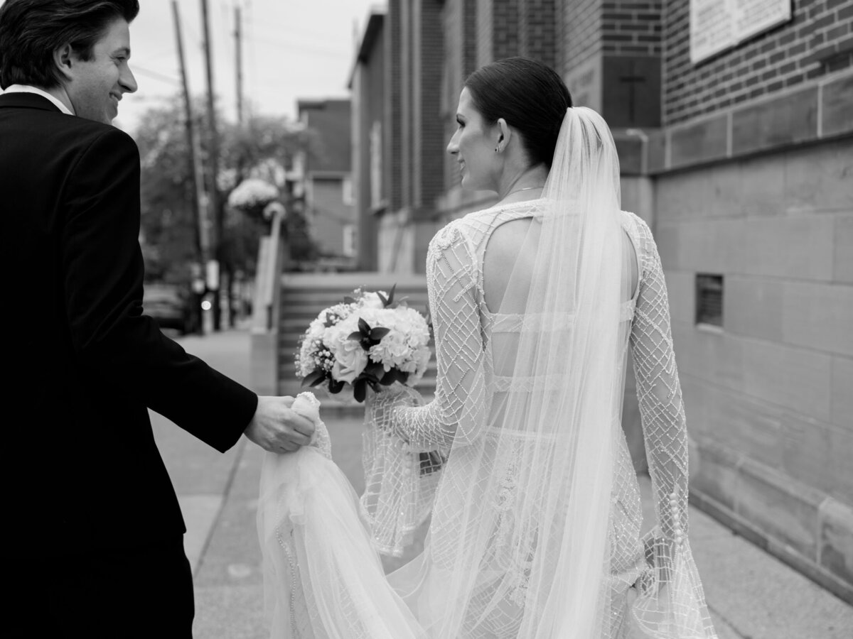 Bride and groom by Holy Rosary Church in Cleveland Ohio