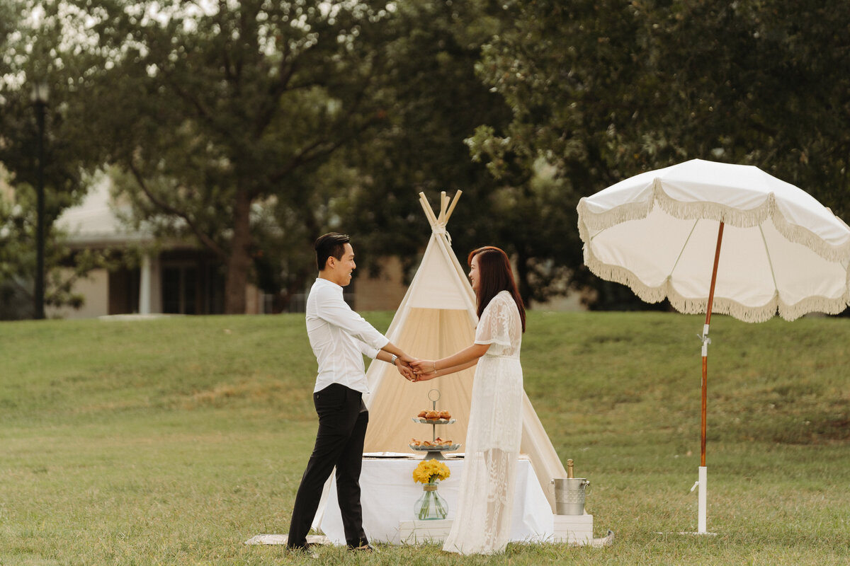 Unique proposal ideas couple holding hands outside