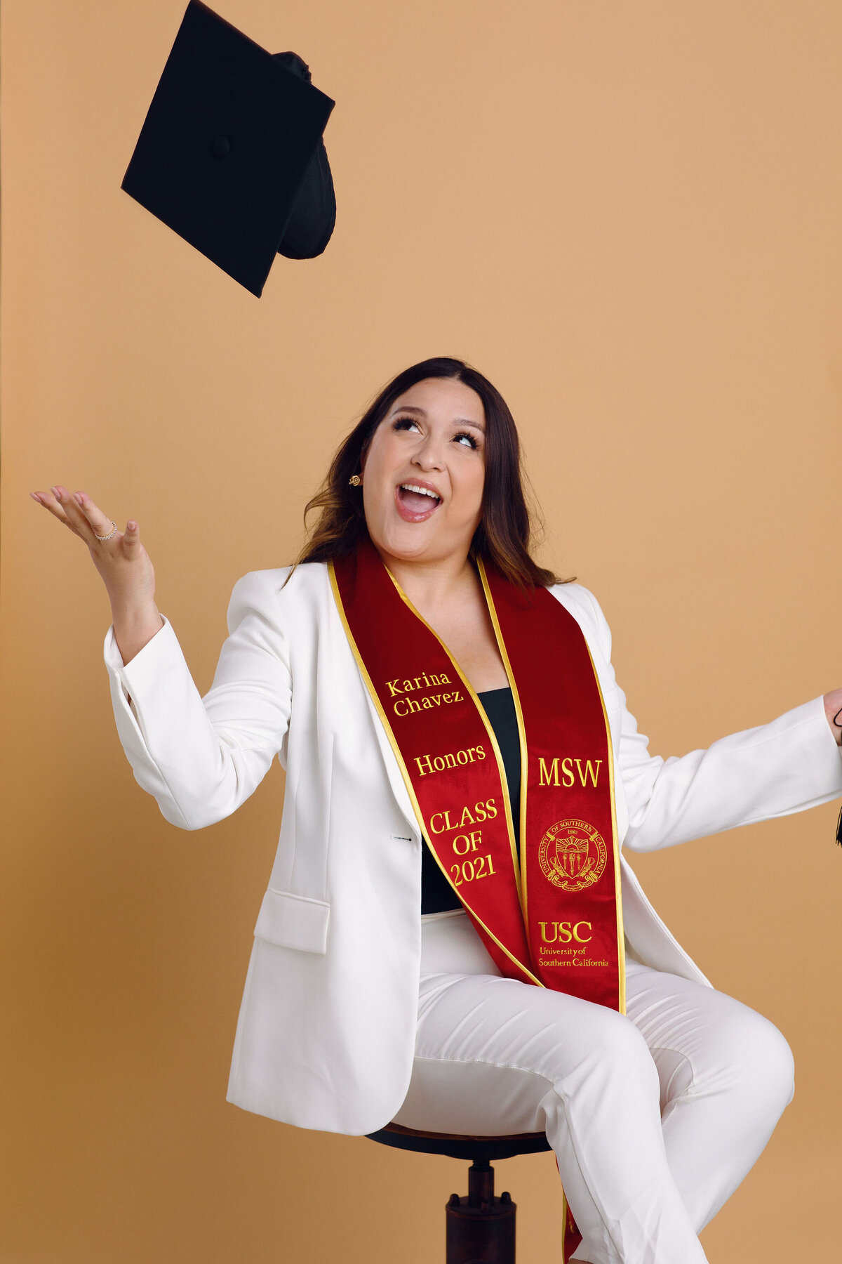 Graduation Portrait Of Young Woman In White Suit Los Angeles