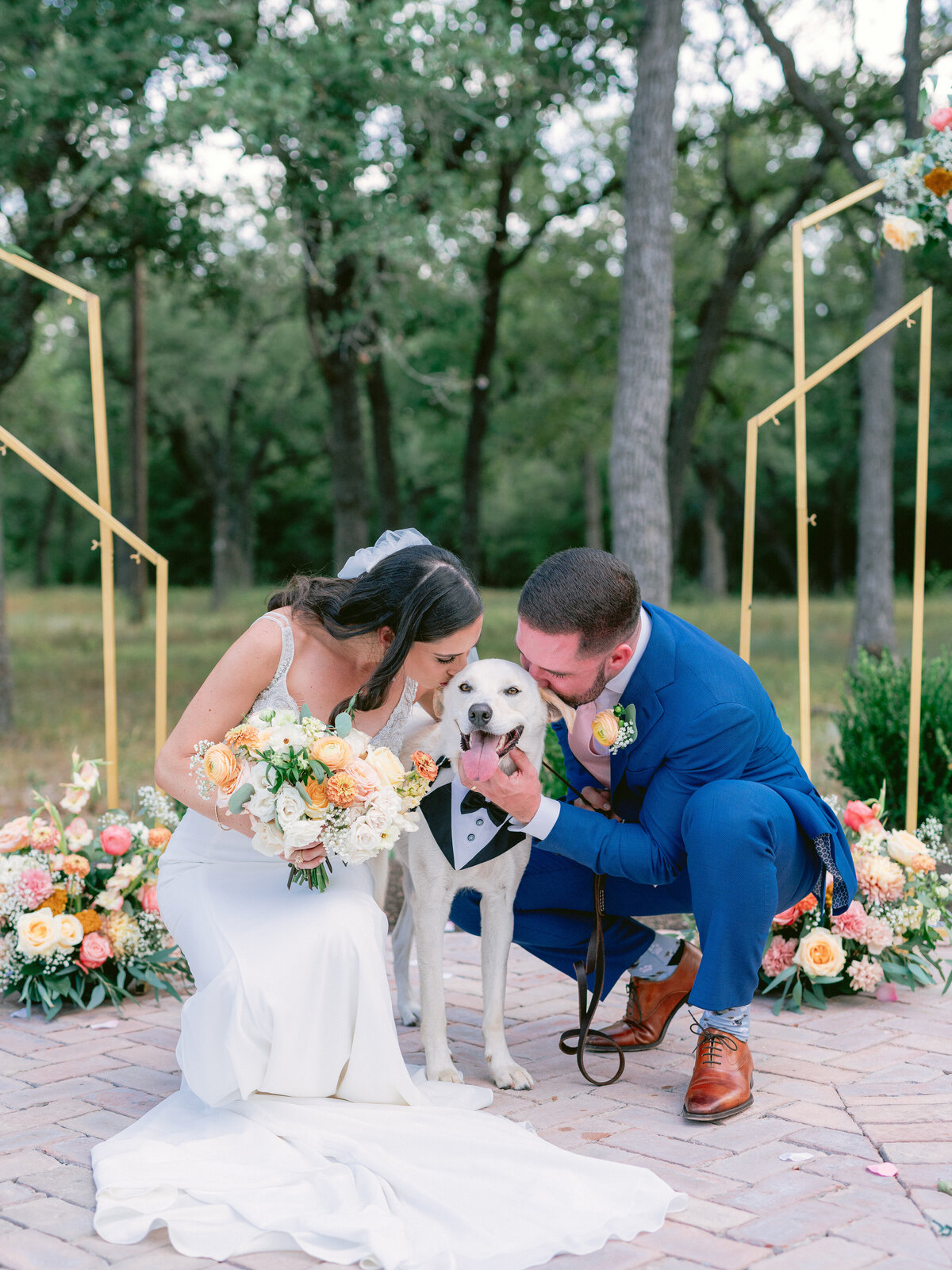 Bride and groom with dog in tuxedo at Grand Lady Austin Wedding