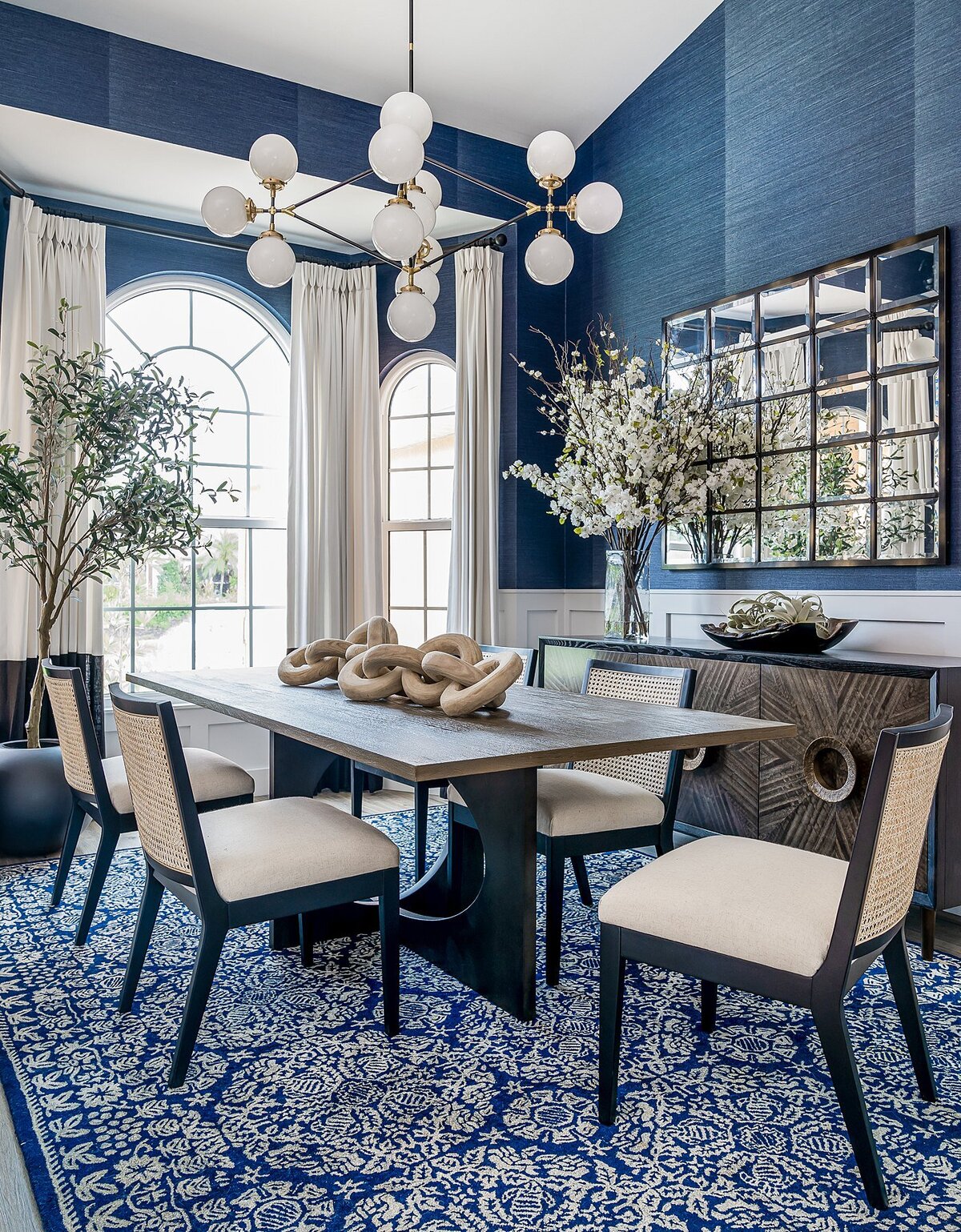 coastal luxury home navy blue dining room full service interior design by Island Home Interiors Lake Nona