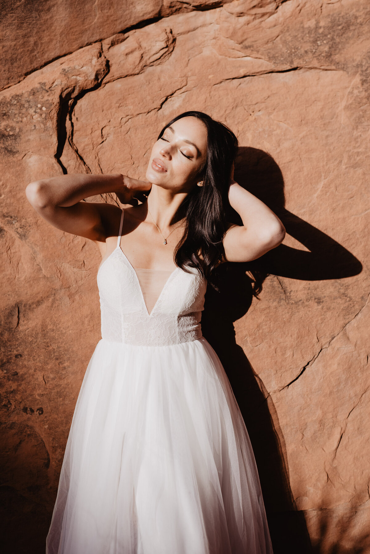 Utah elopement photographer captures bride smiling in sun