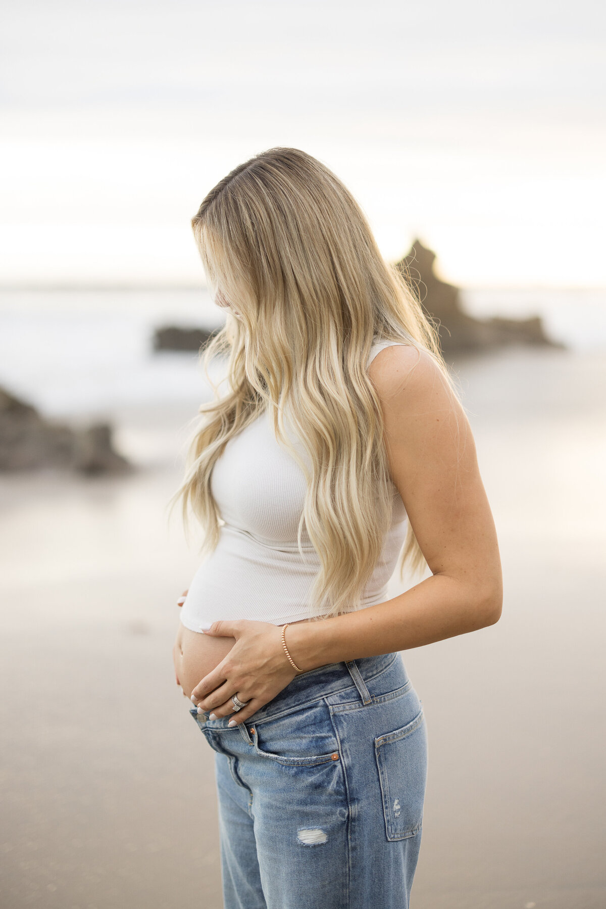 warm maternity photo at the beach