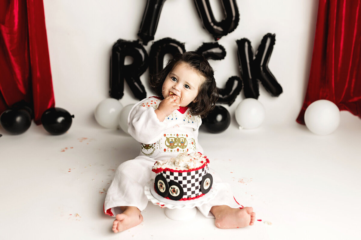 Elvis theme cake smash session in Fort Collins, CO with baby boy and his awesome dark hair