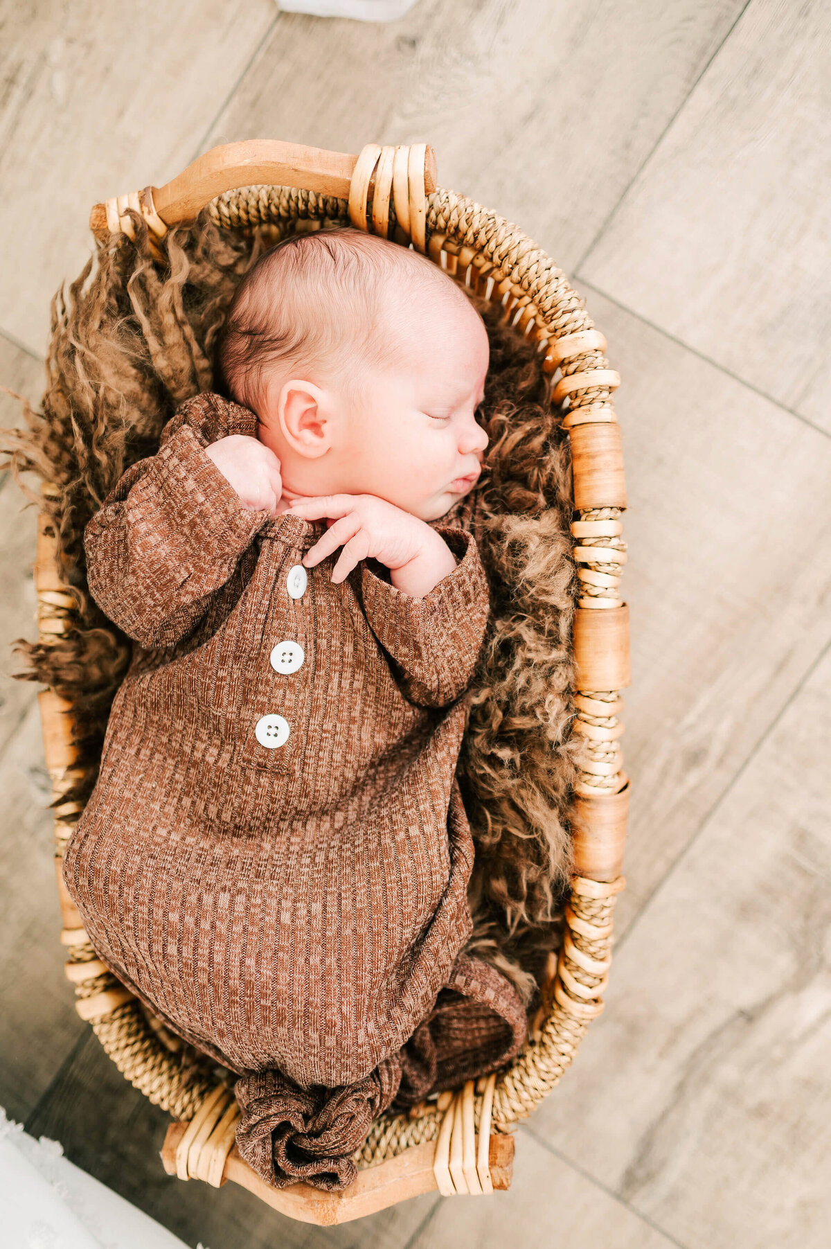 newborn sleeping in basket captured by Springfield MO newborn photographer Jessica Kennedy of The XO Photography
