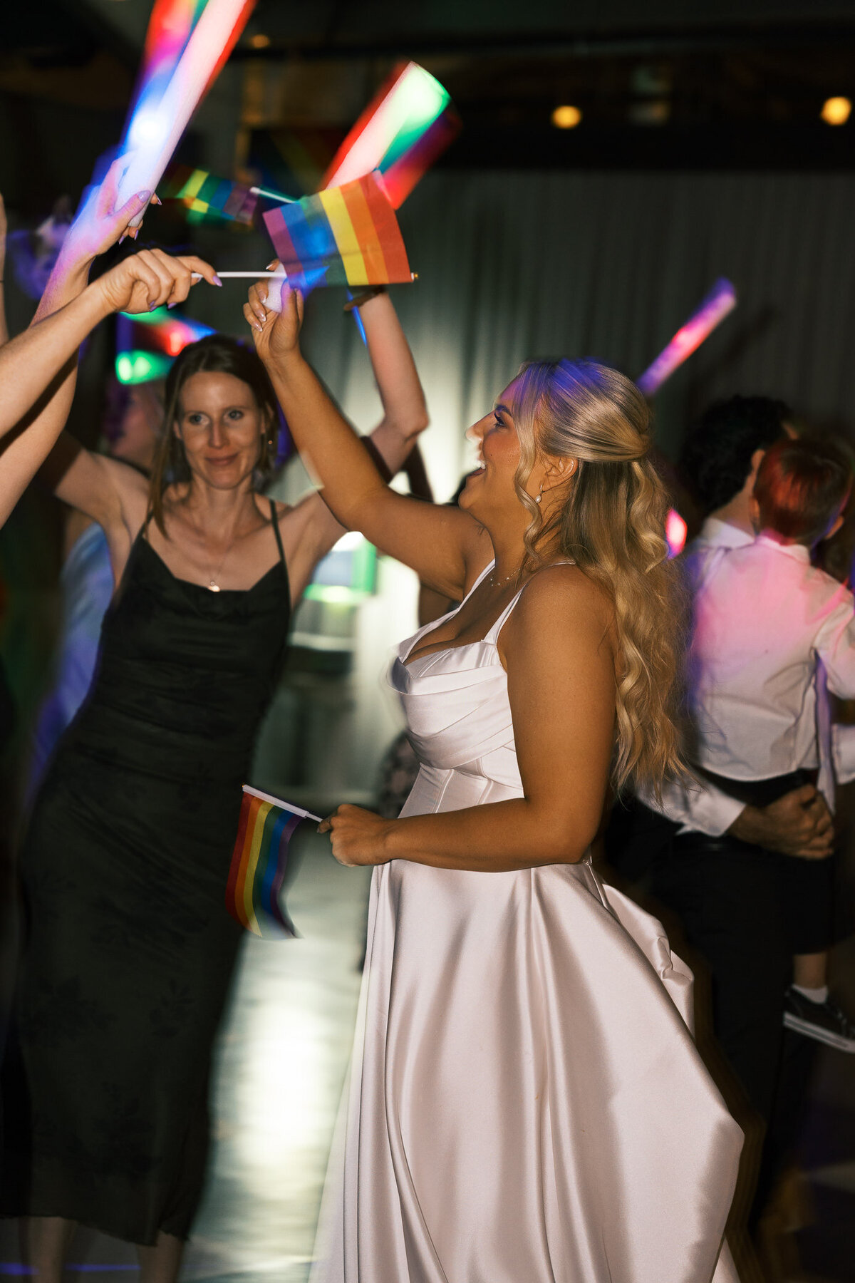dance-floor-glowsticks-pride-flags-bride-lgbtq