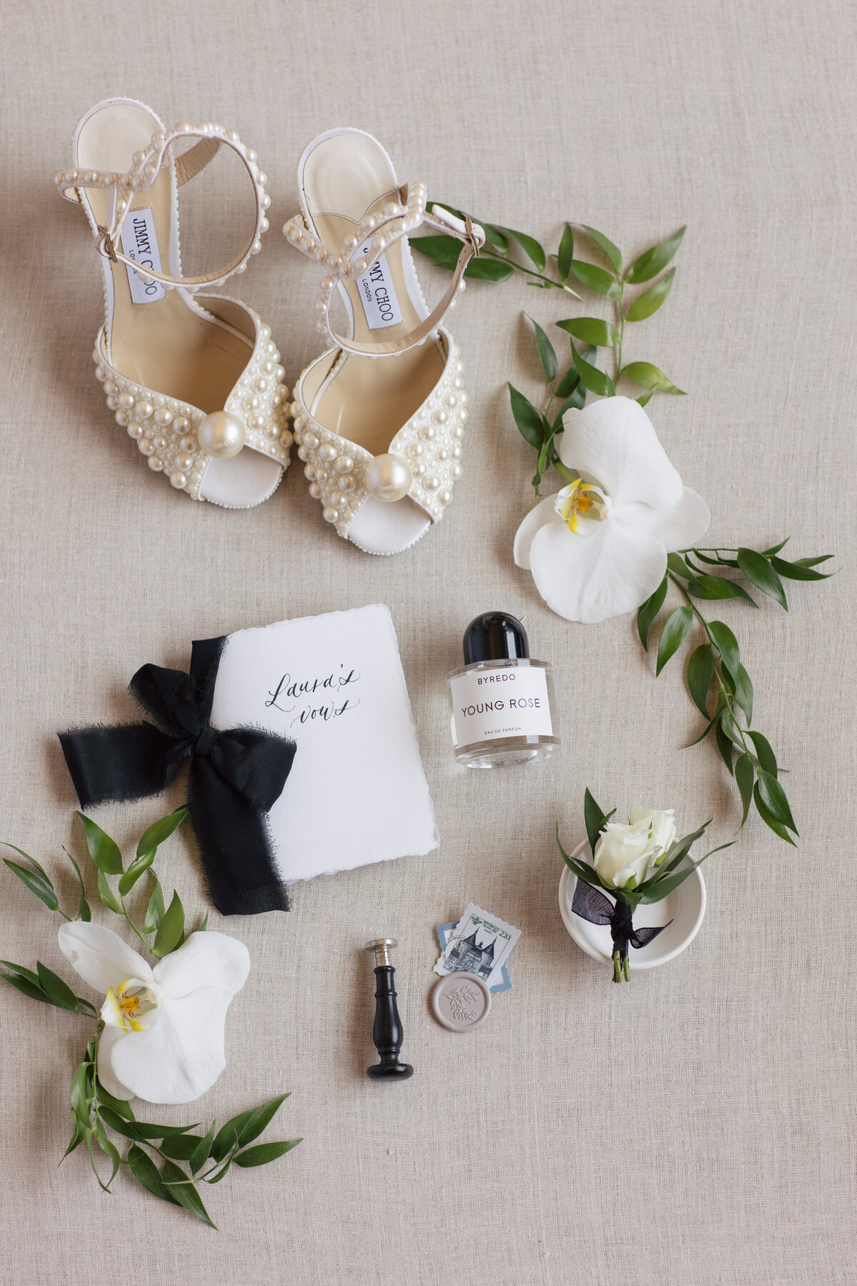 Flat-Lay with Jimmy Choo shoes with white Orchids