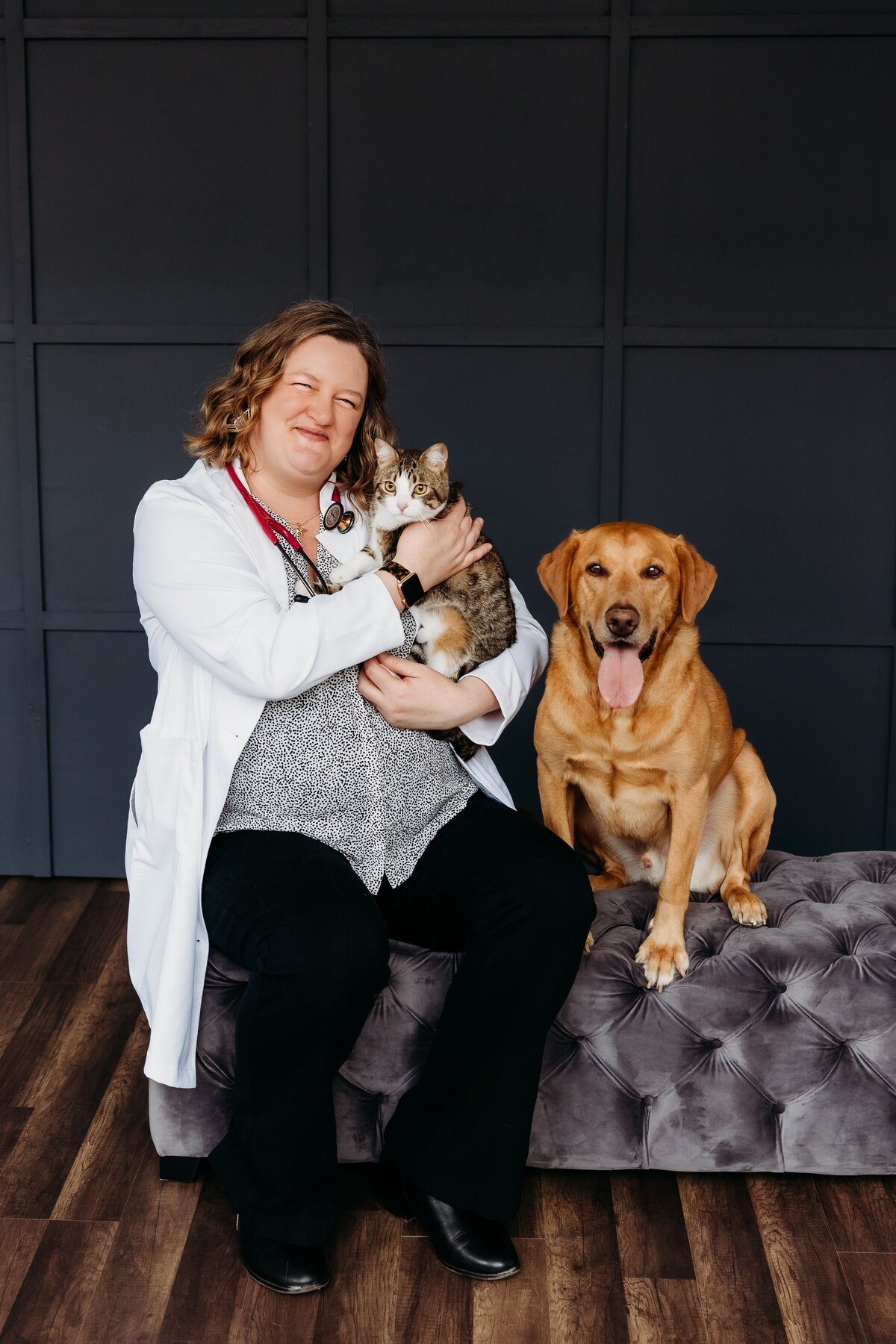 Veterinary doctor holding her pets during a headshot photoshoot.