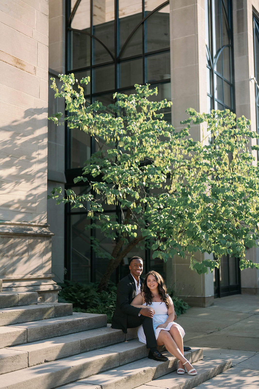 Elegant Kalamazoo engagement portrait framed by architectural shadows.