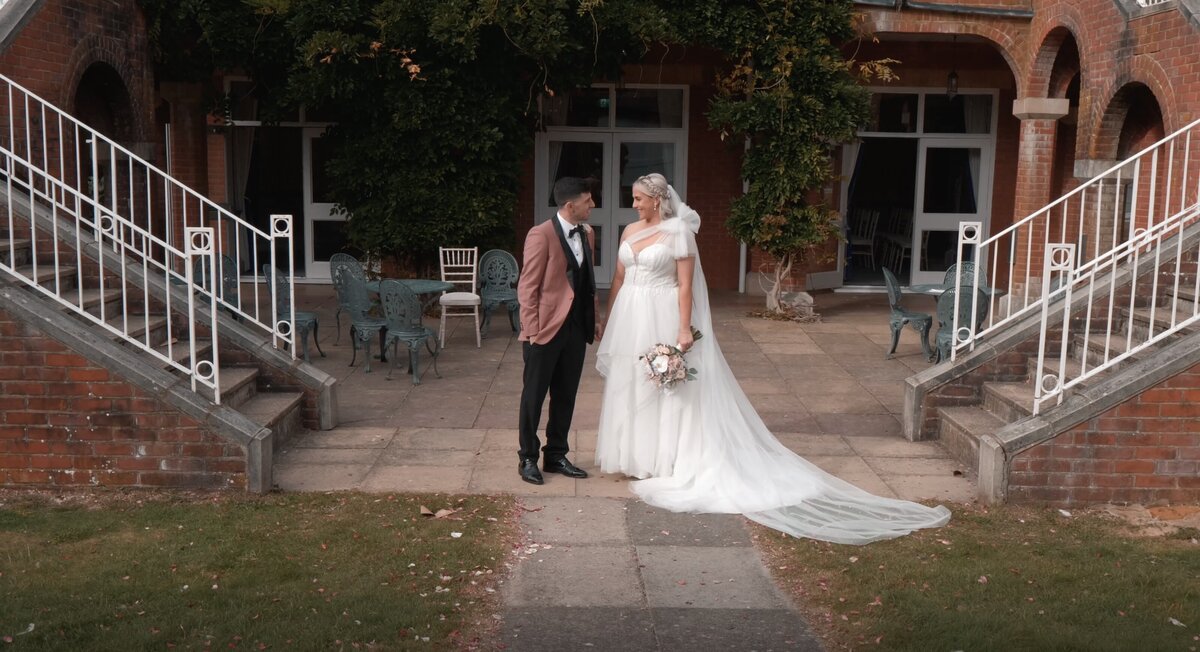 The Bride and Groom on their wedding day. From the wedding highlights film shot at Pendley Manor, Hertfordshire by Hertfordshire wedding videographer HC Visuals.
