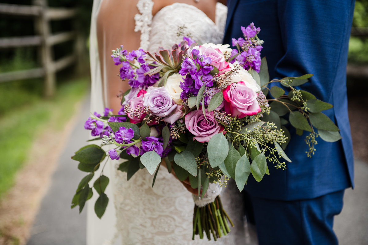 Bridal bouquet with purple white and pink