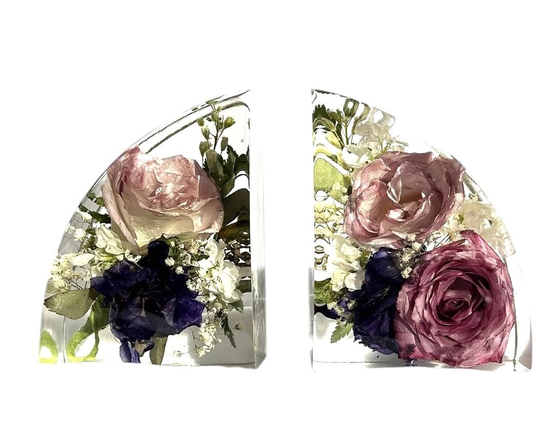 bookend resin block with purple and pink wedding bouquet and grooms boutonniere preserved as a family heirloom