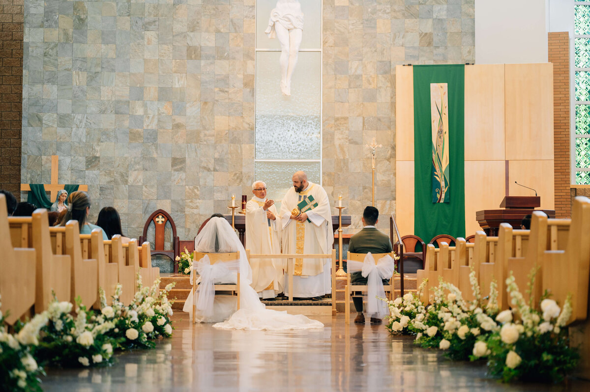 flower aisle pieces at wedding in big church