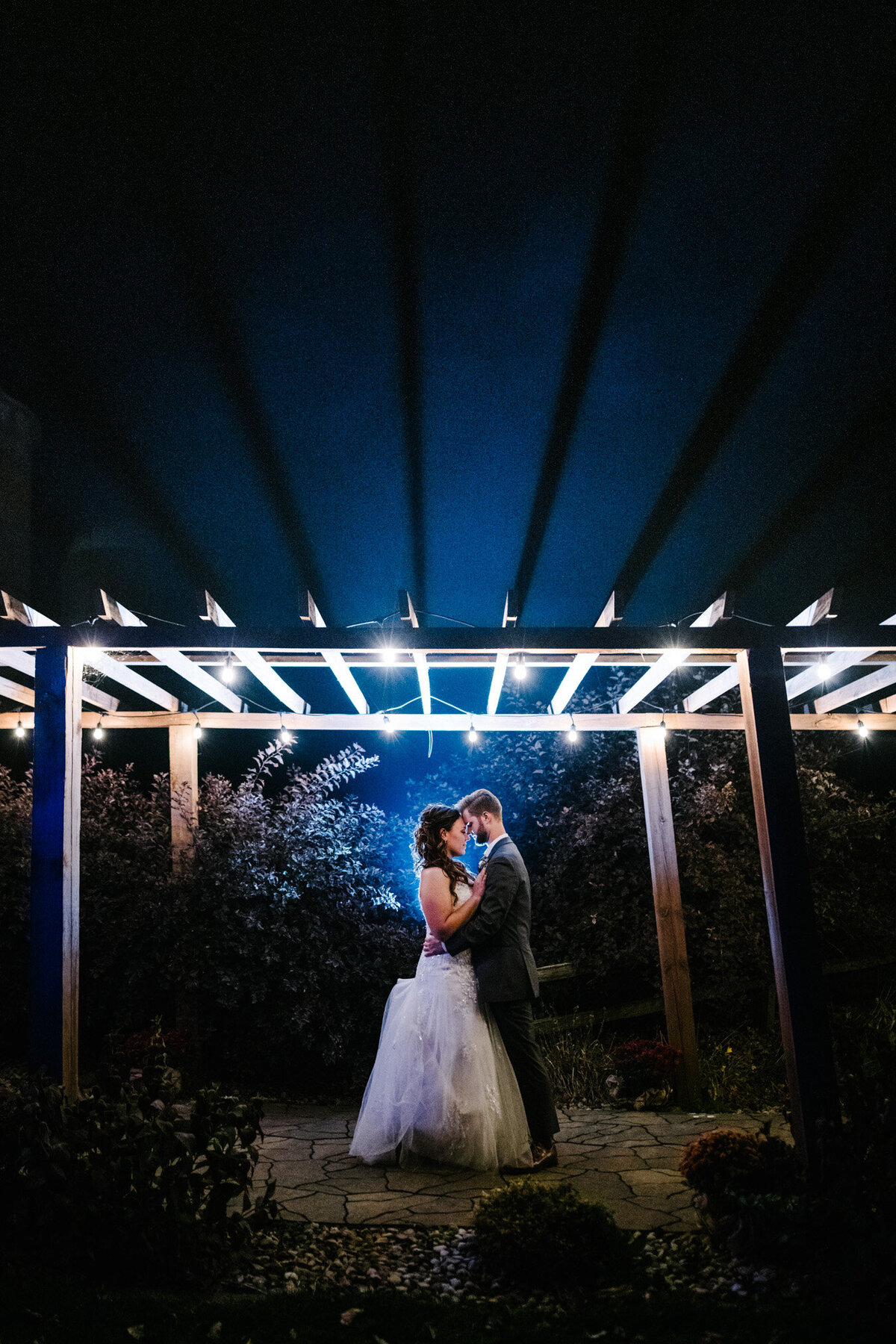 night photo of bride and groom