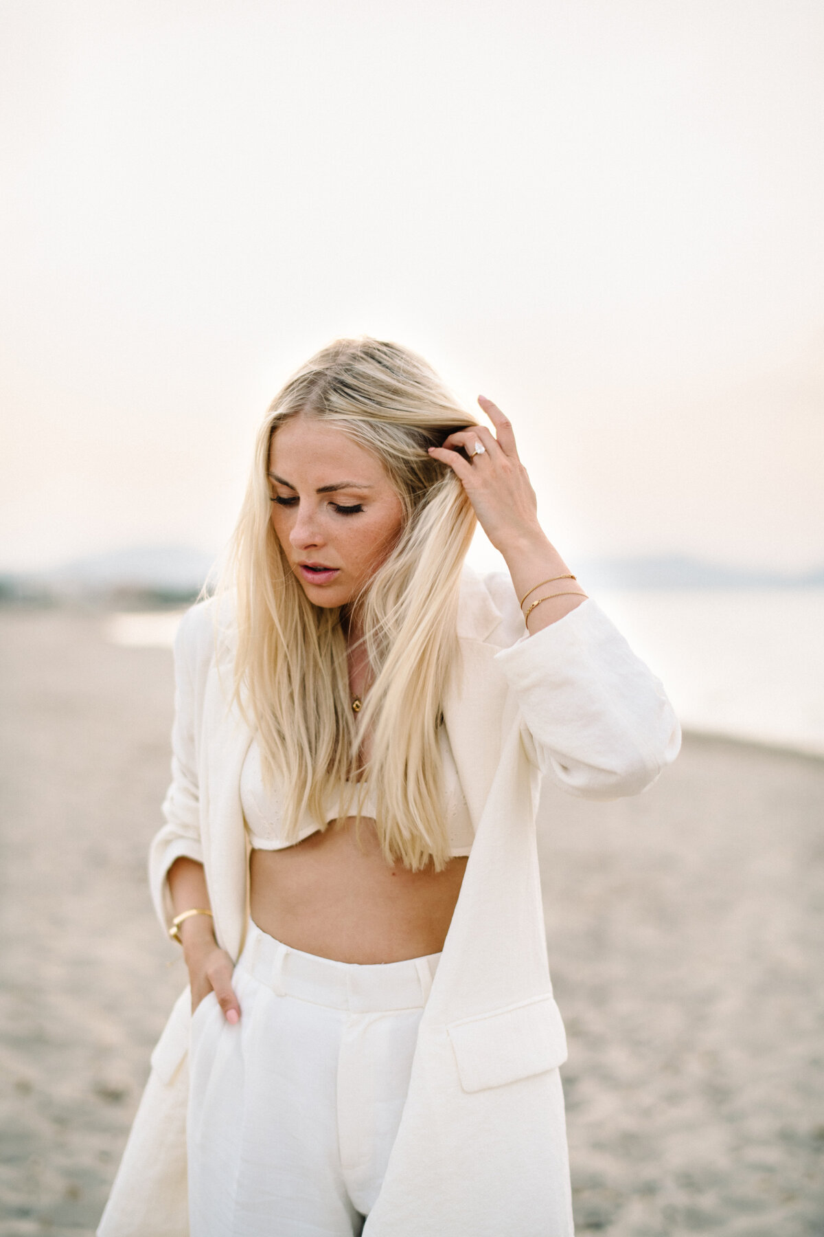 beach editorial with white linen outfit mallorca
