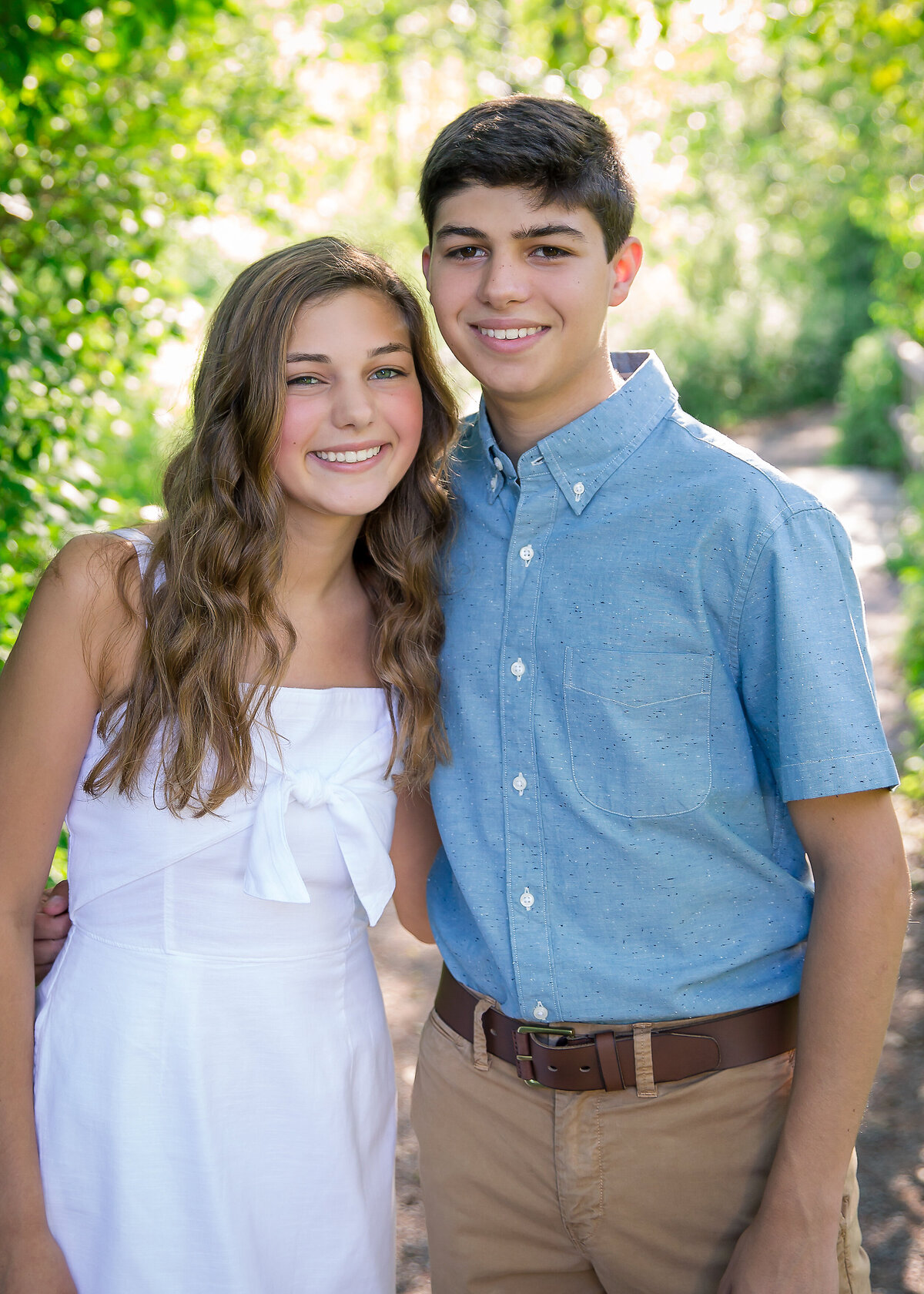 Teenage brother and sister family portrait wearing white and blue near Victor, NY