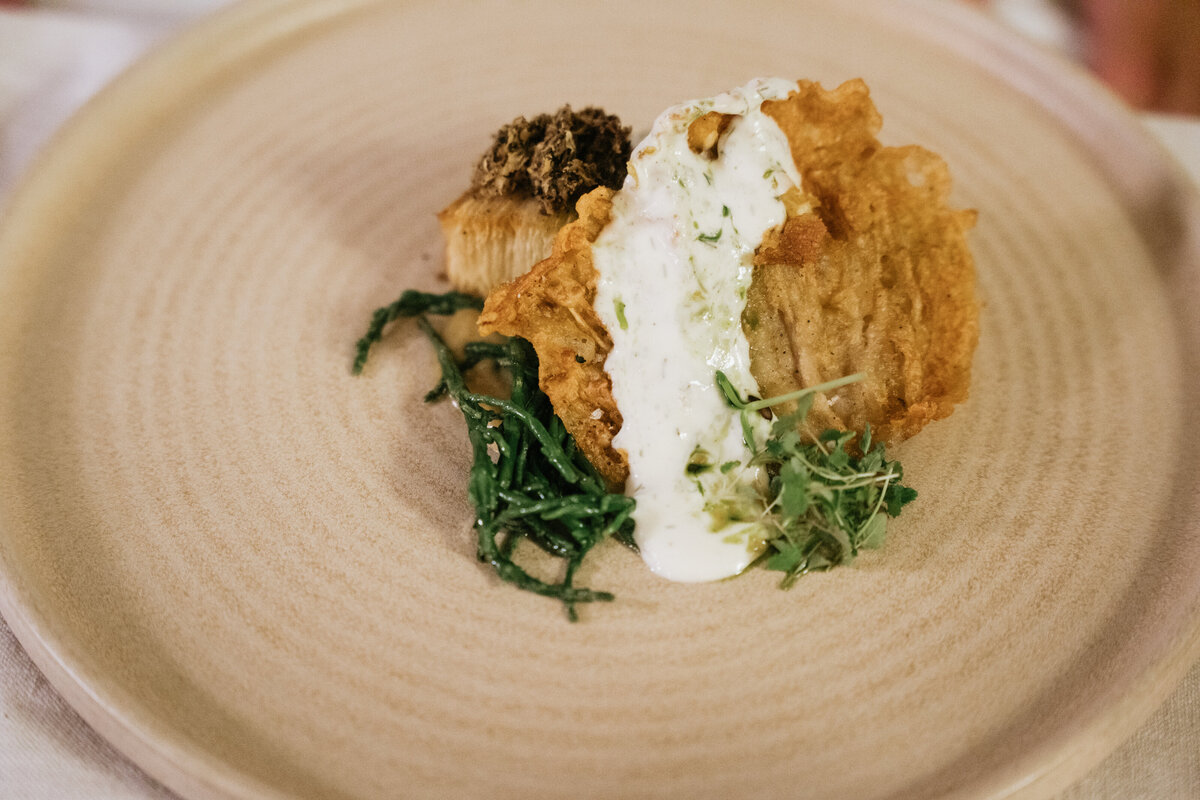 Vegan plated dish with autumn leaf garnish
