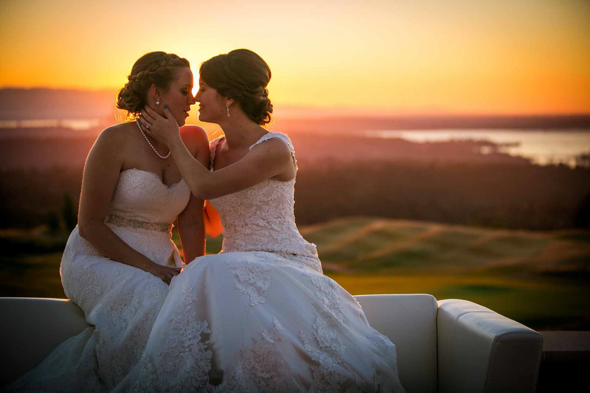 two brides at wedding during sunset