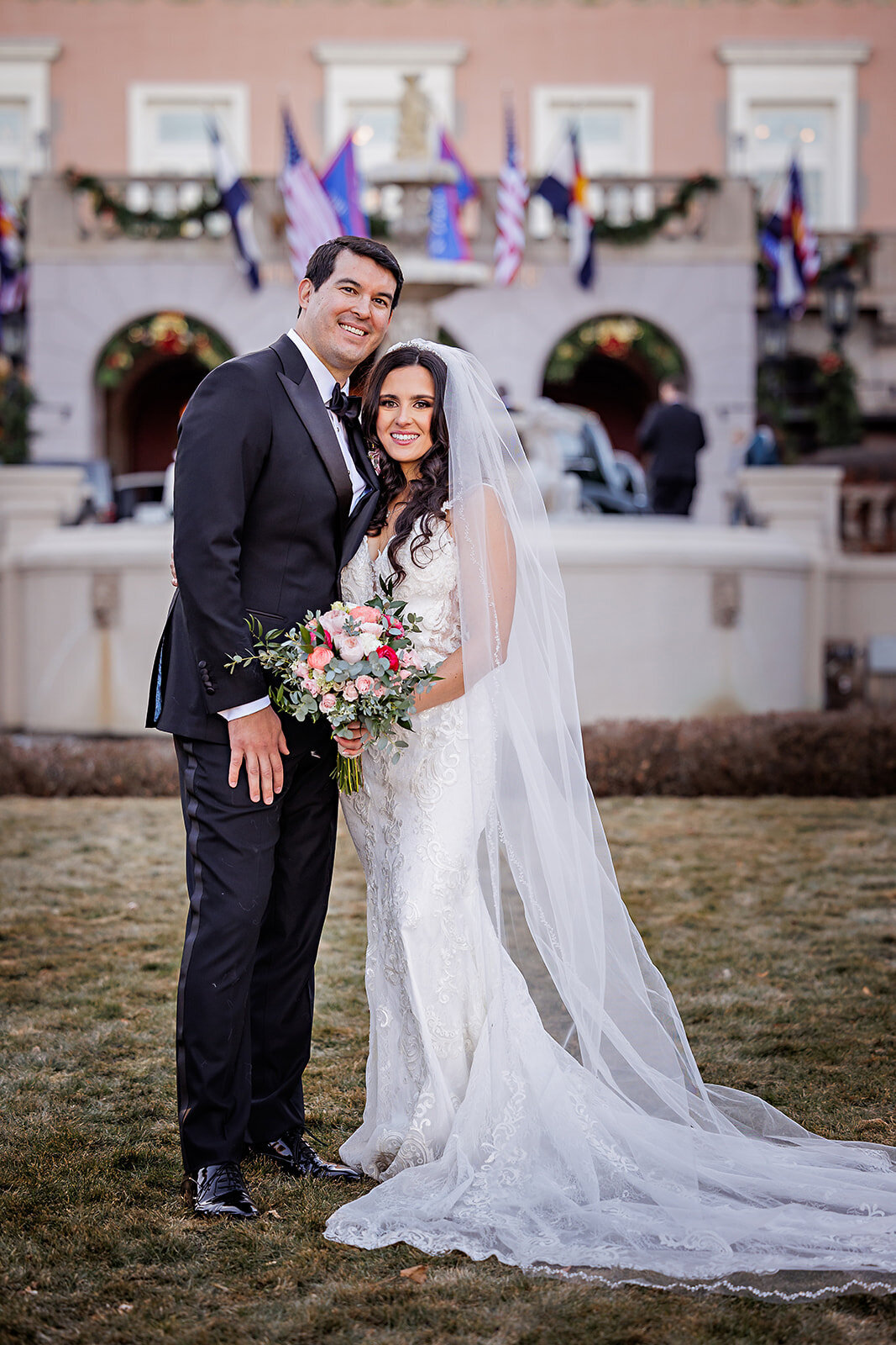 Bride and Groom at the Broadmoor hotel with a sage and blush bouquet.