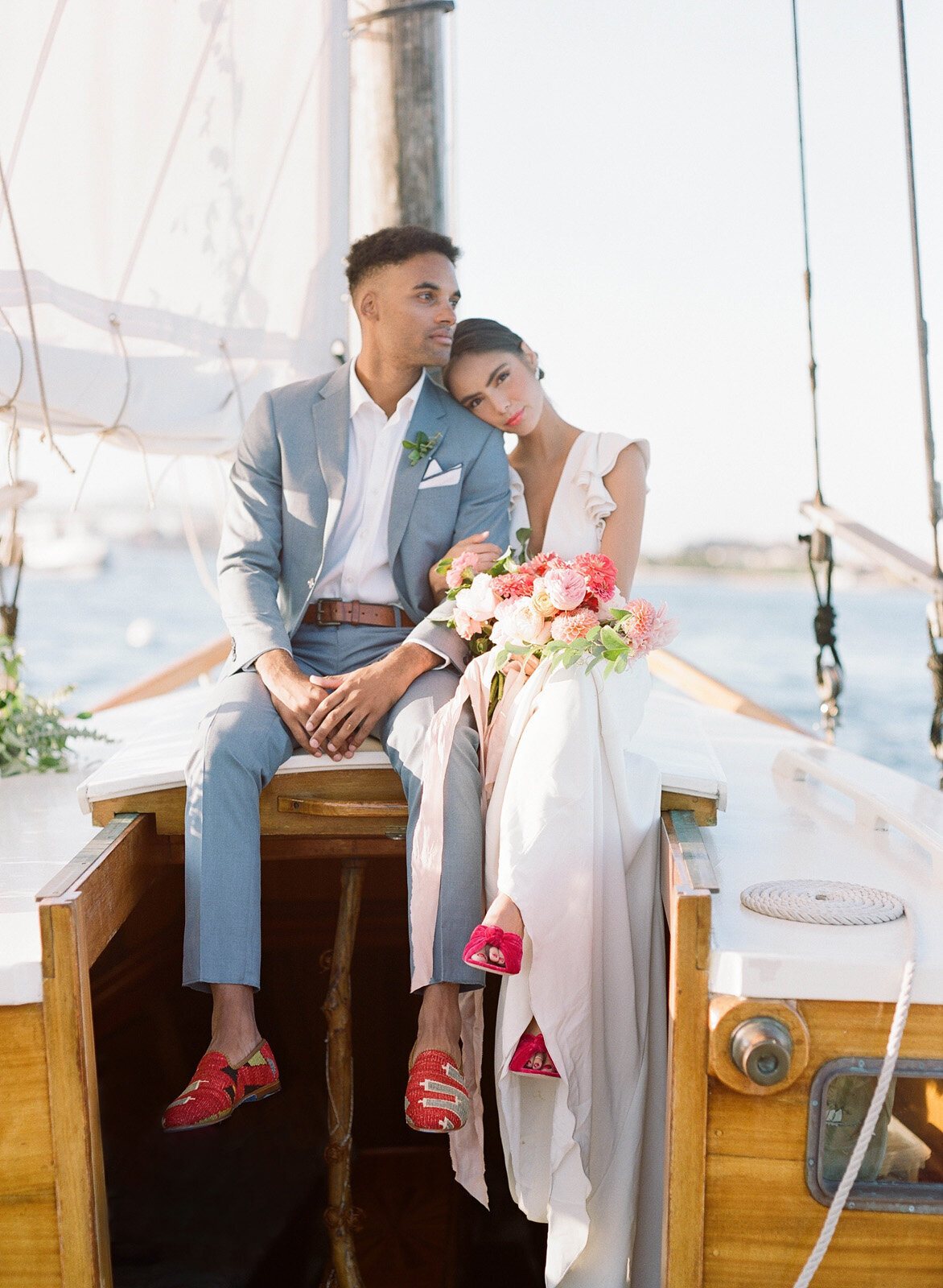 Kate-Murtaugh-Events-elopement-wedding-planner-Boston-Harbor-sailing-sail-boat-yacht-greenery-water-blue-suit-casual