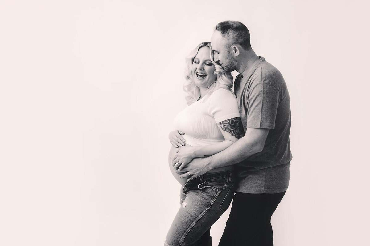 Expectant Parents pose for Maternity Photos in Asheville, NC Maternity Photography Studio.