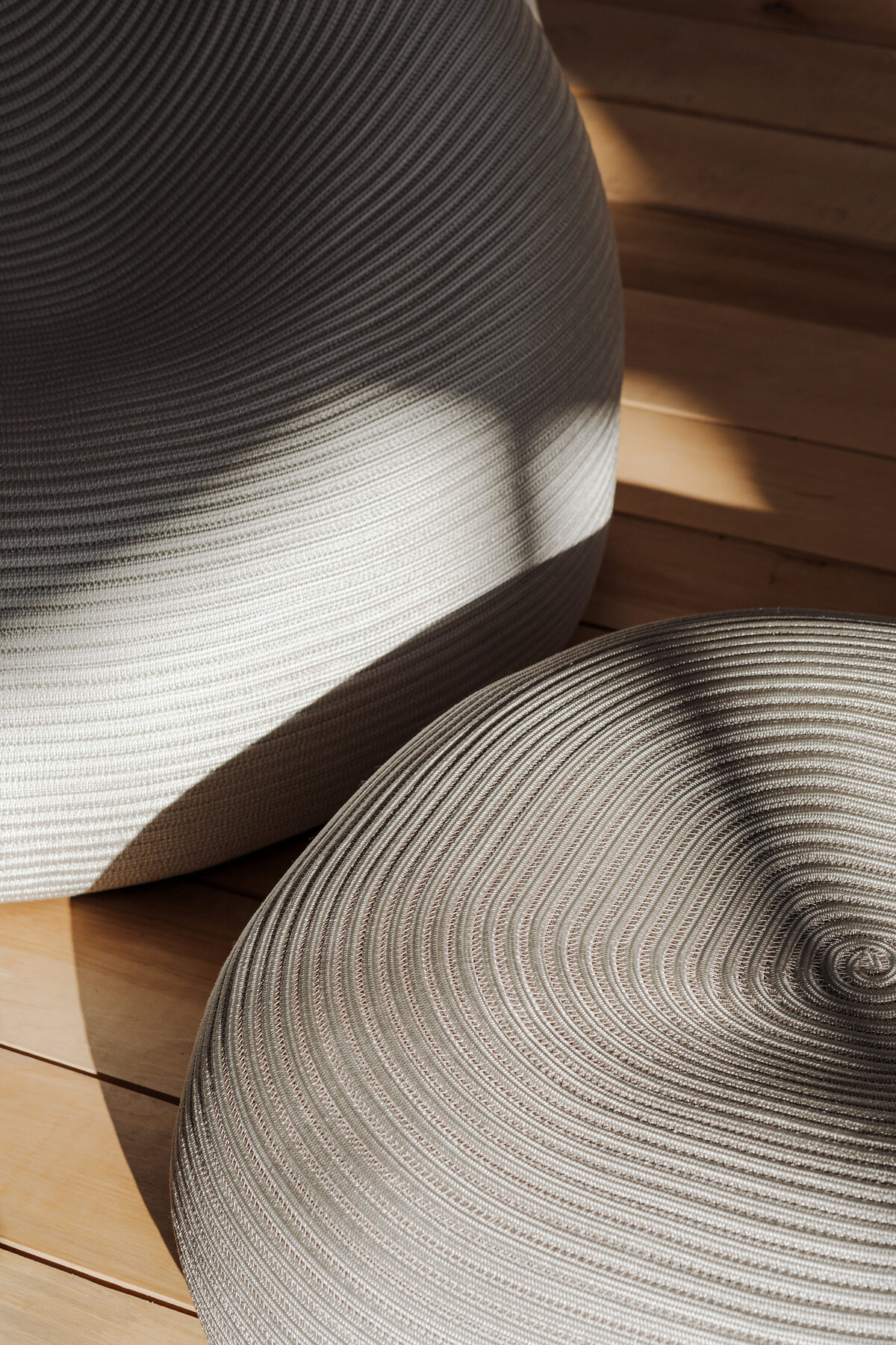 kaboompics_softly-lit-patterned-poufs-on-wooden-floor-37002