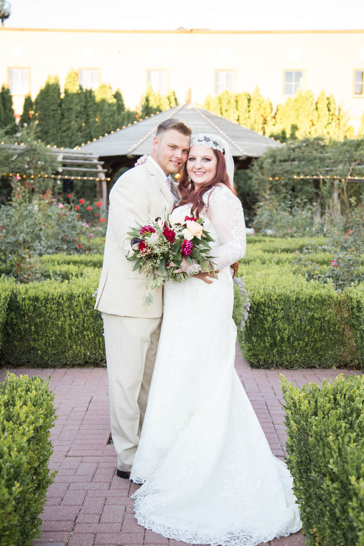 Wedding photography portrait of a bride and groom in lush green garden