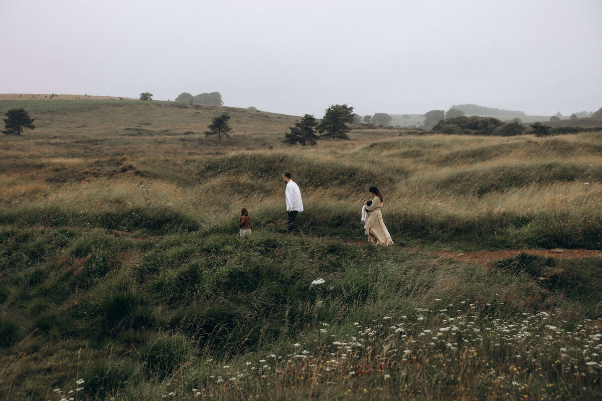 family walking in a field