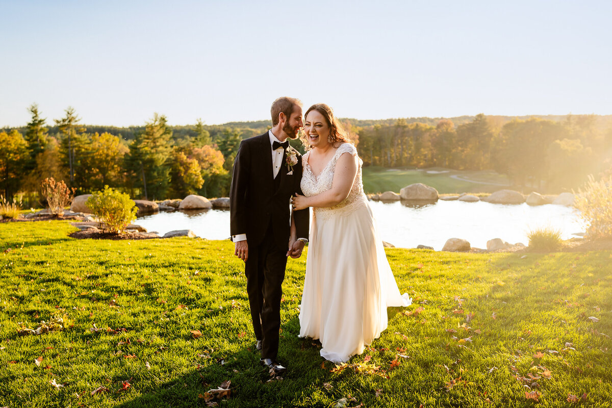 Bride and groom walking and laughing at sunset at Pembroke Pines Country Club by NH Wedding Photographer Lisa Smith Photography