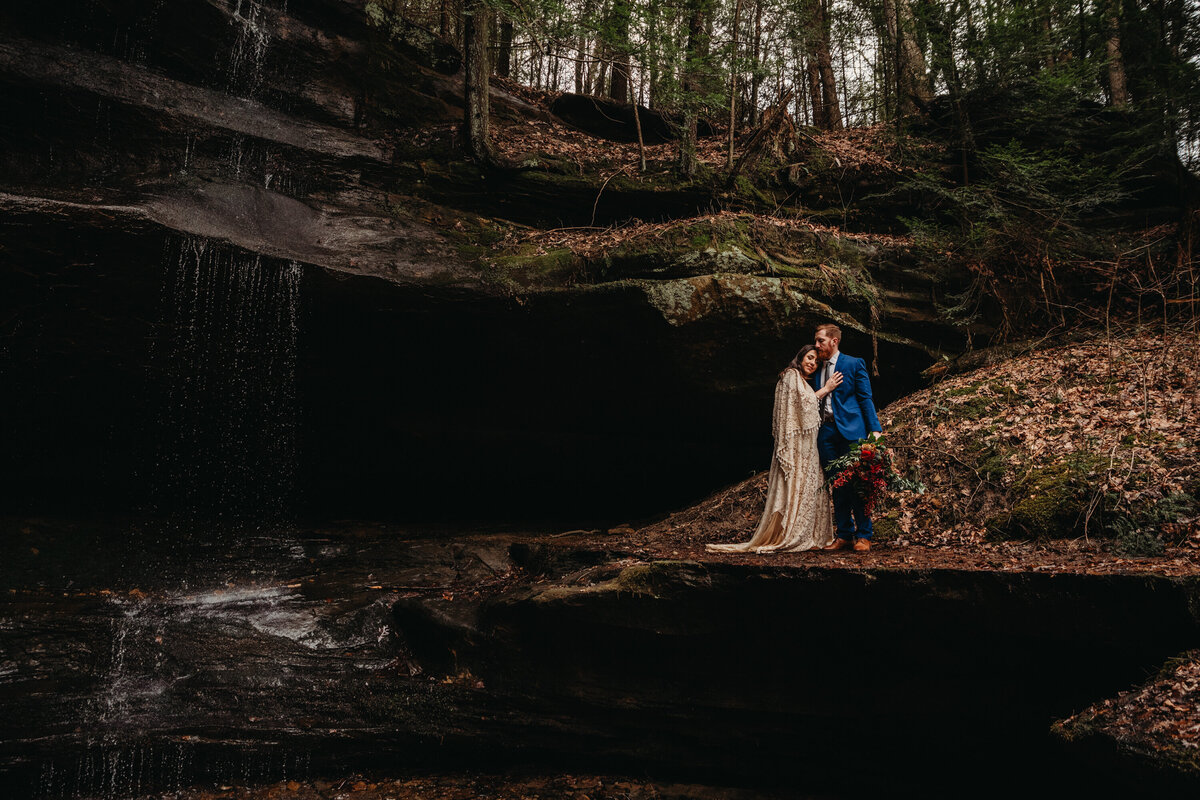 Waterfall elopement in Hocking HIlls, boho couple photographed by Paige Mireles