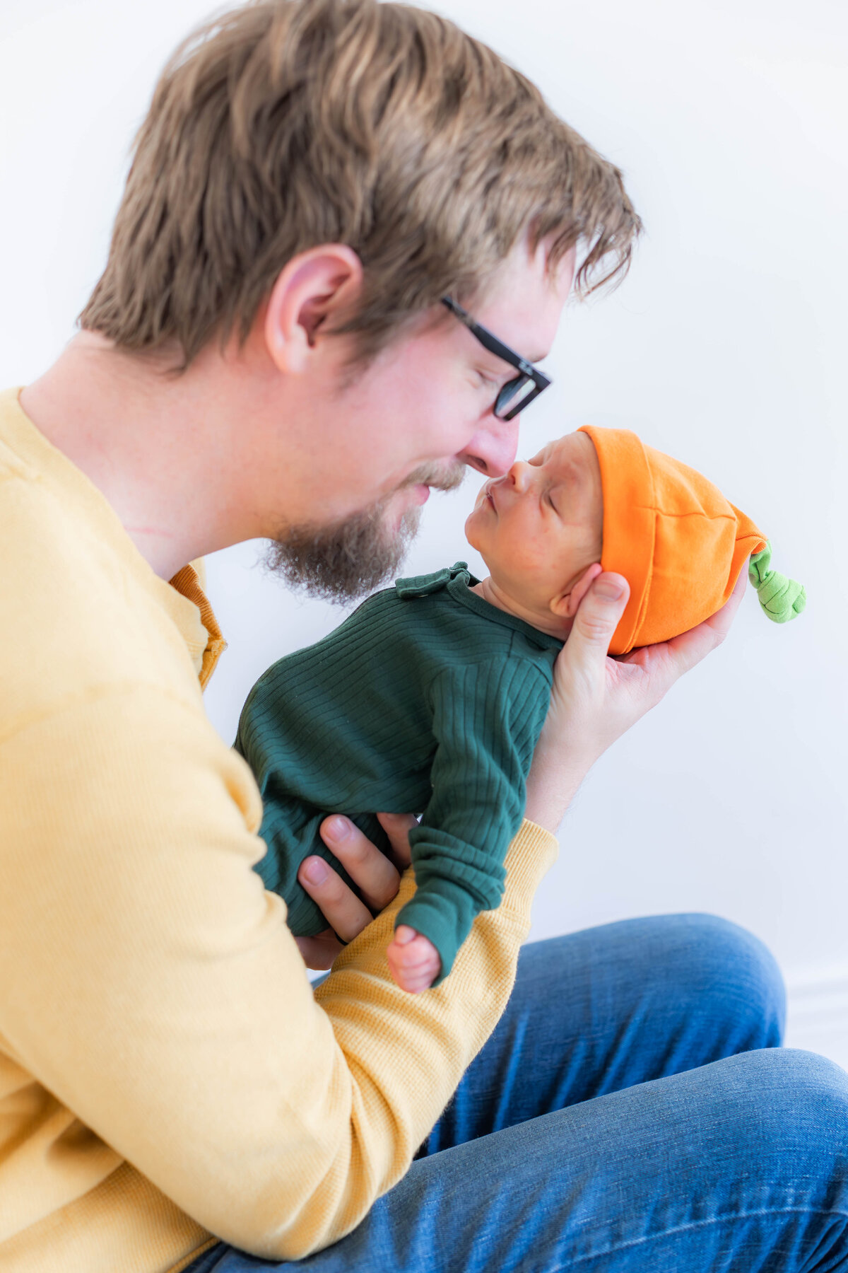 Natural lifestyle newborn photos in Provo Utah, capturing real family connection and tender newborn moments with dad and baby by a Provo Utah photographer and Utah County Newborn Photographer 