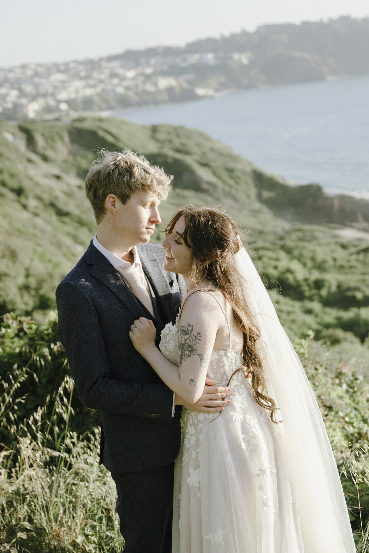 Bride and Groom at Marshall's Beach in San Francisco, California at sunset