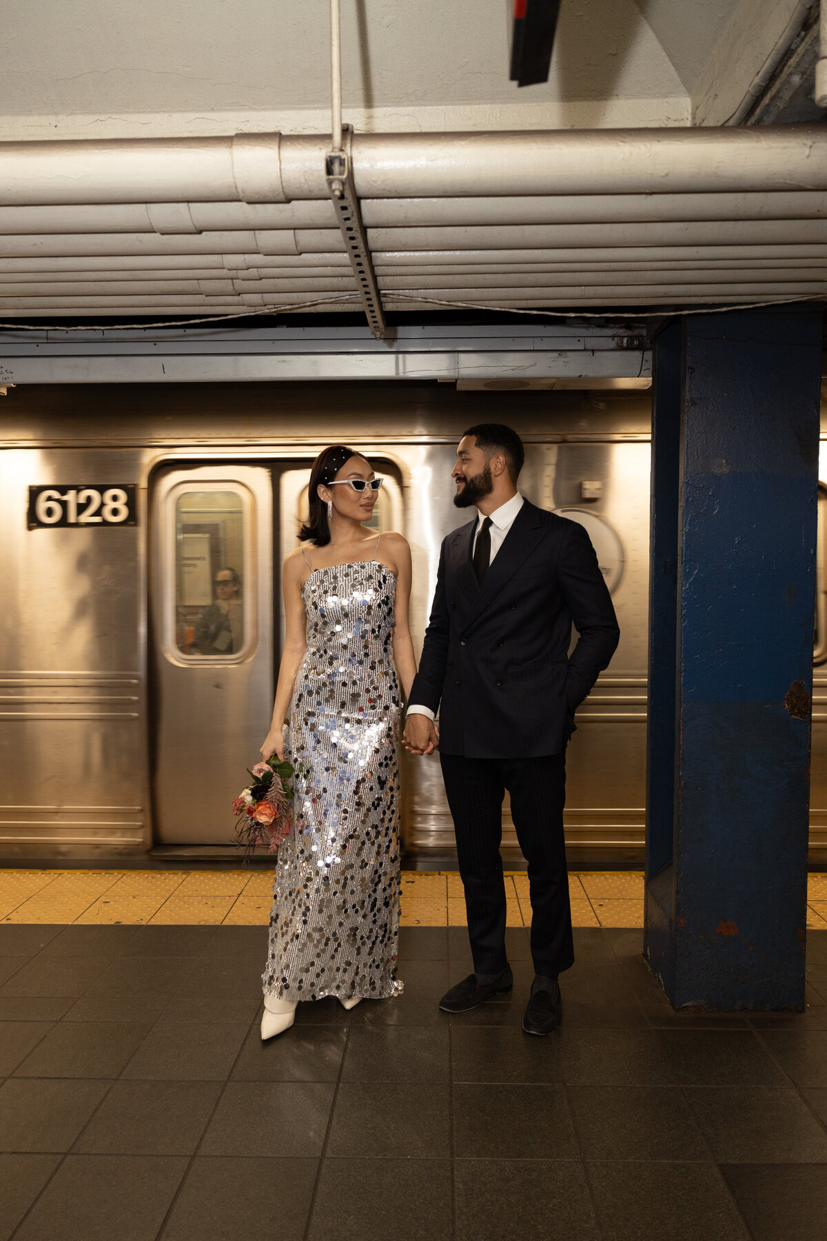 Modern, urban editorial elopement session on the NYC subway, capturing bold style and romantic vibes.