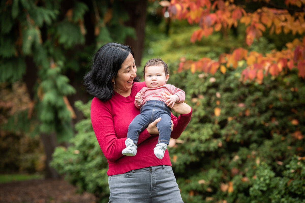 A person holding a small baby