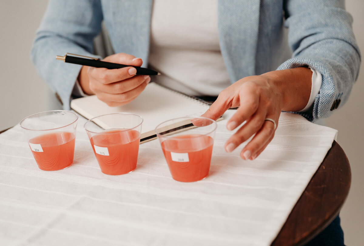 woman dipping a chicken nut into sauce from Chick fil A